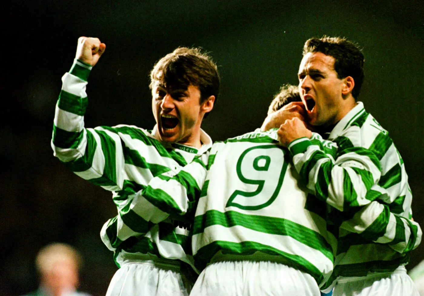 Lubomir Moravcik (left) celebrates Celtic's first goal, scored by Harald Brattbakk (centre) as Paul Lambert hugs him during a Scottish Premier league football match against St Johnstone's, at the Park Head stadium in Glasgow. 